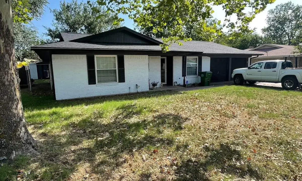 Professional roofing crew working on a residential roof in St. Thomas